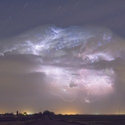 Cumulo nimbus Lightning Storm and Star Trails Above